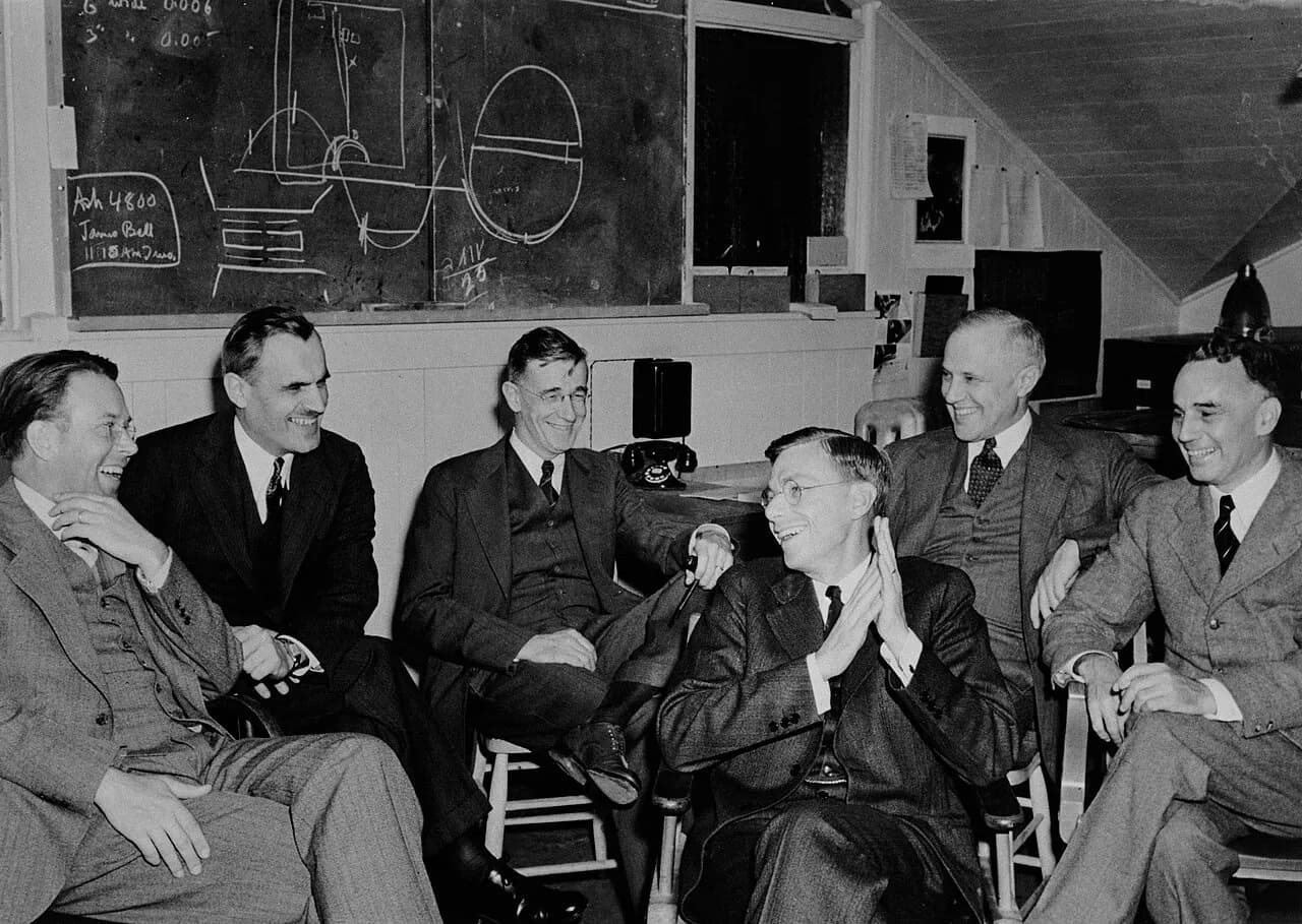 Group photo of E. O. Lawrence, A. H. Compton, V. Bush, J. B. Conant, K. Compton, and A. Loomis in March 1940 at UC Berkeley meeting