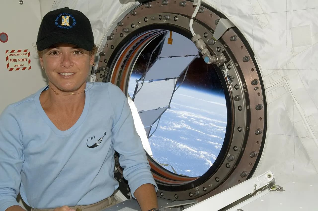 Canadian Space Agency astronaut Julie Payette, STS-127 mission specialist, is pictured near a window in the Kibo laboratory of the International Space Station w