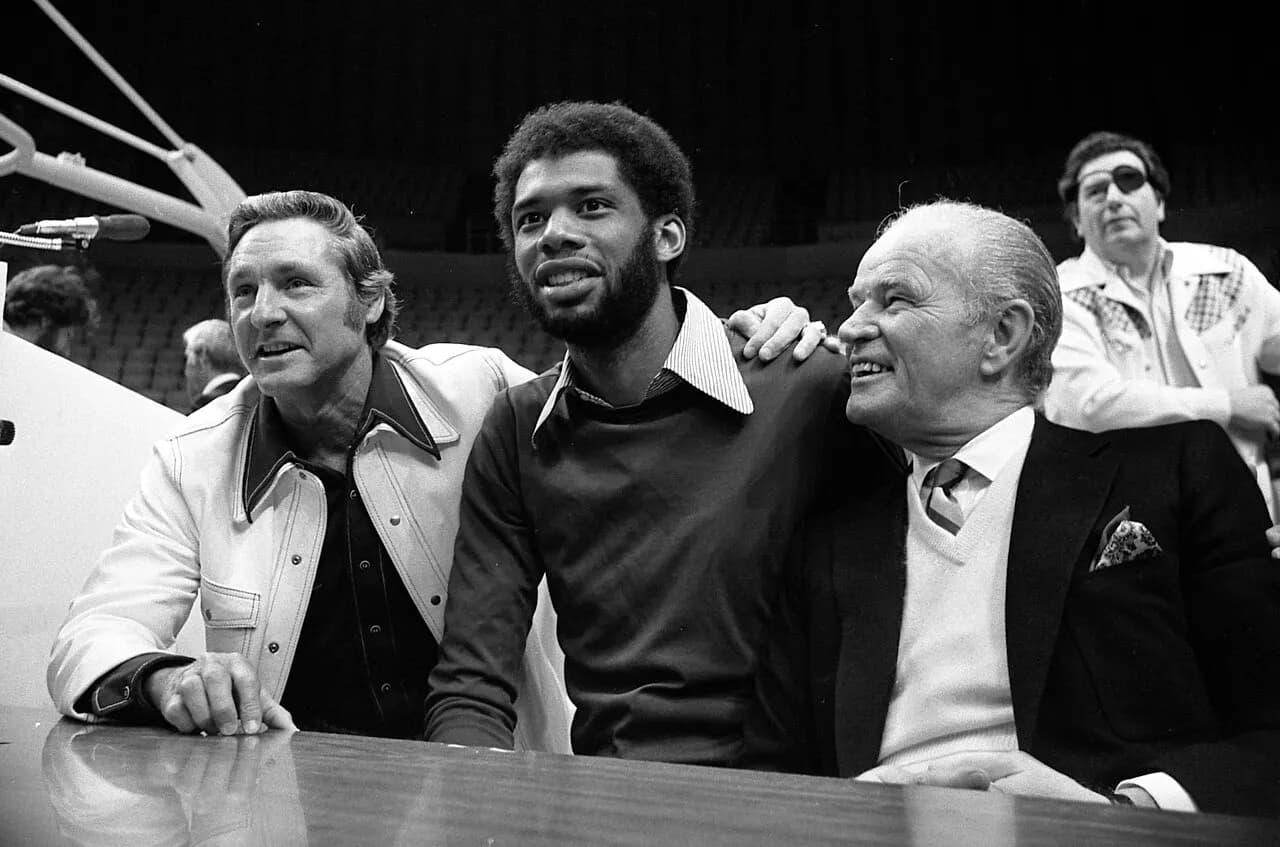 Bill Sharman, Kareem Abdul-Jabbar and Jack Kent Cooke at press conference announcing Lakers' signing Kareem in Los Angeles