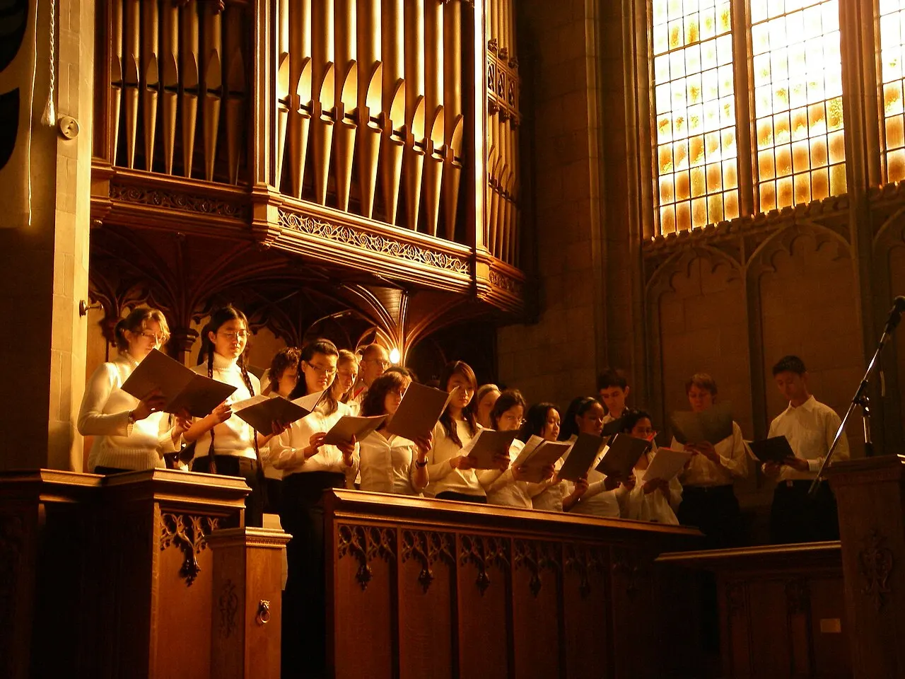 Skule Choir with sunlight streaming into Knox Chapel, taken during Christmas concert performance led by Malcolm McGrath